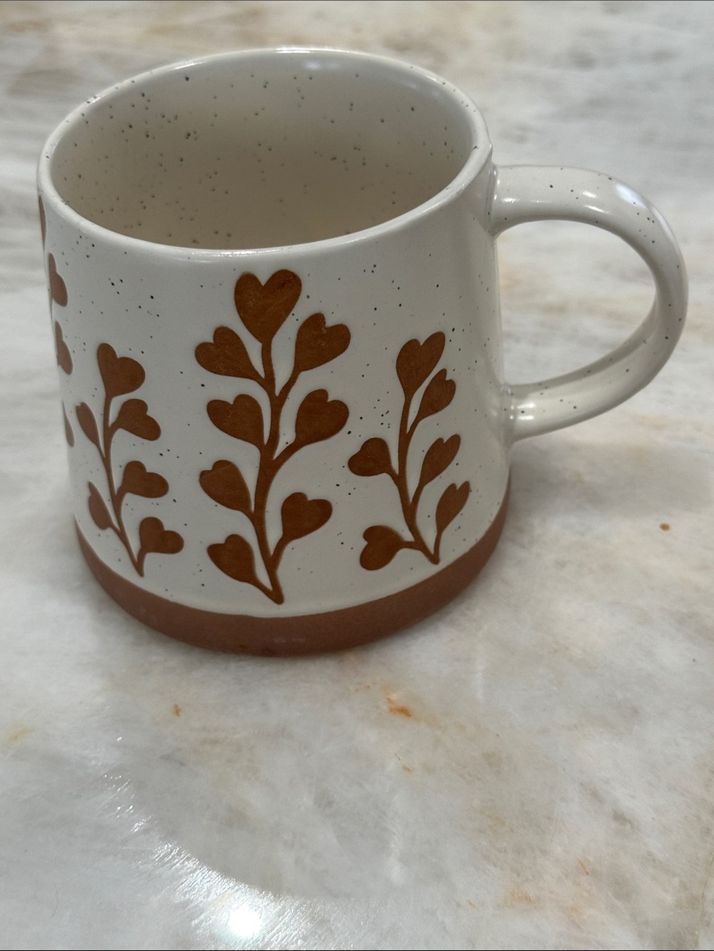 Speckled White Ceramic Mug with Brown Leaf Design